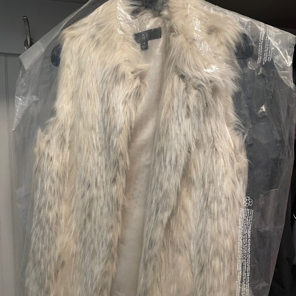 Cream snow leopard faux fur vest.